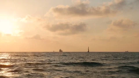 Dramatic sunset with clouds over mediterranean sea, yacht and ship on horizon 스톡 동영상 77483318