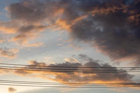 Dramatic Sunset Clouds Over Power Lines Stock Photos