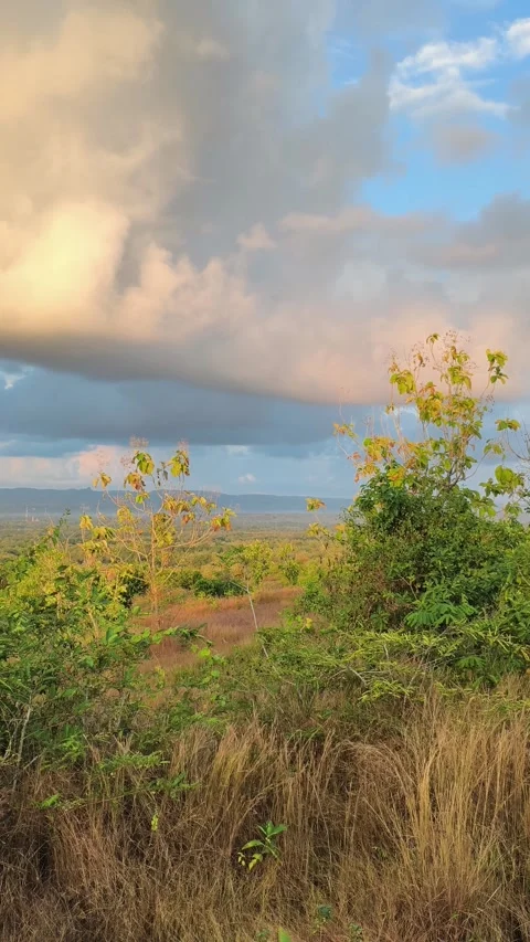 Dramatic Sunset Clouds Over Rural Hillside Landscape Stock Footage 340420339