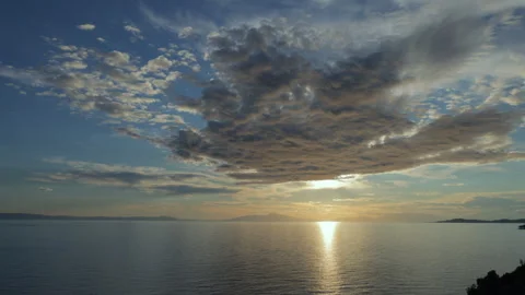 Dramatic sunset with clouds over the sea in Greece Stockbeeldmateriaal 293231927
