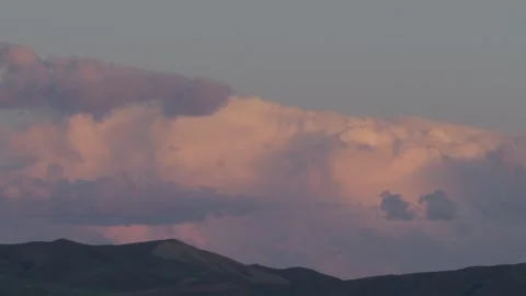 Dramatic sunset clouds over steppe hills, Kazakhstan Stock Footage 333910625