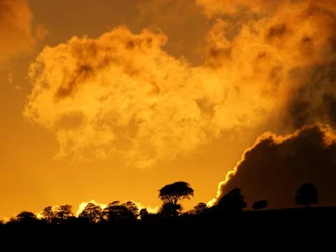 Dramatic sunset with clouds Stock Photos