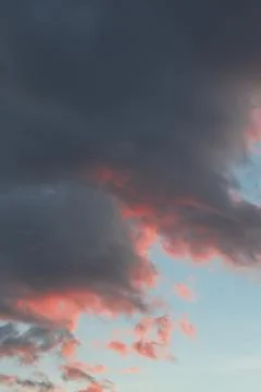 Dramatic Sunset Clouds with Pink and Orange Hues Stock Photos