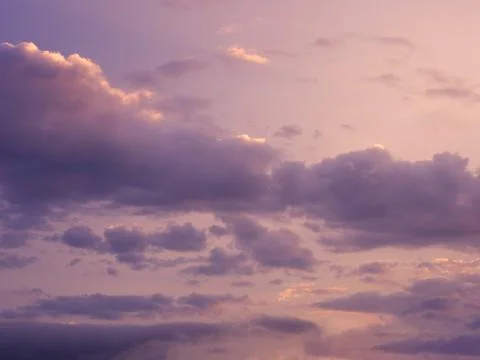 Dramatic sunset. Clouds in wide open sky. Beautiful heaven. Stock Photos