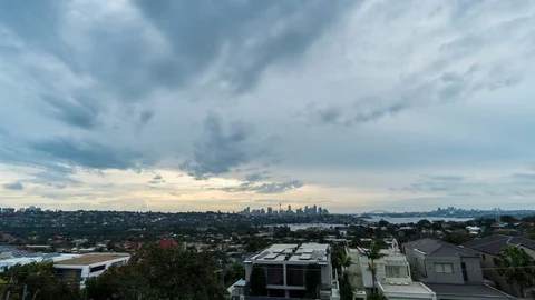 Dramatic sunset cloudscape timelapse in generic modern cityscape Stock Footage 84160385