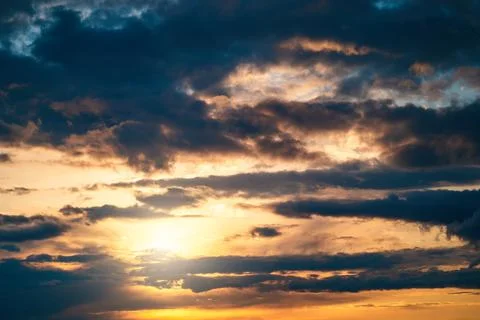 Dramatic sunset cloudy sky with blue clouds as abstract beautiful cloudscape Photos
