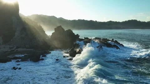 Dramatic Sunset Coastline with Powerful Ocean Waves Drone Footage Stock Footage 338313604