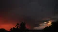 Dramatic sunset colored storm clouds with lightning strike slo-mo 5 HD 影片