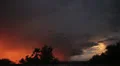 Dramatic sunset colored storm clouds with lightning strike slo-mo 4 Video HD