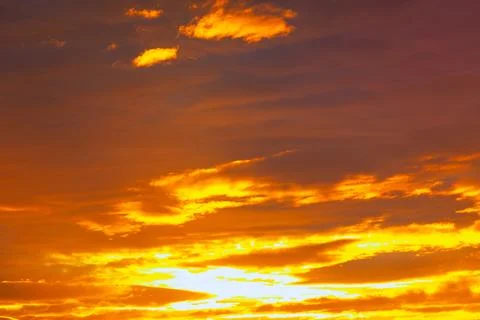 Dramatic sunset colors reflected in clouds Stock Photos