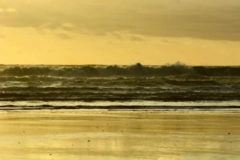 Dramatic sunset colours; beautiful sunset on a beach. Stock Photos