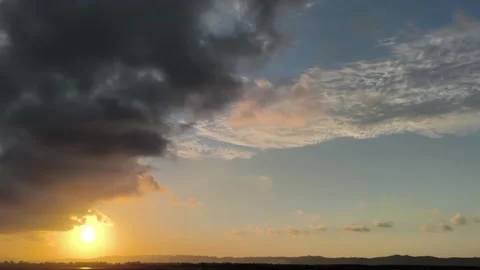 Dramatic Sunset with Dark Storm Clouds Over Rural Horizon Landscape Stock Footage 340465228