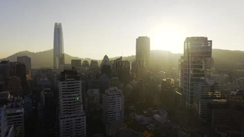 Dramatic sunset drone slide across Costanera Center skyline Santiago Chile Vídeos de archivo 334682848