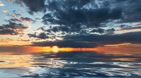 Dramatic sunset during the rain with blue sky Stock Photos