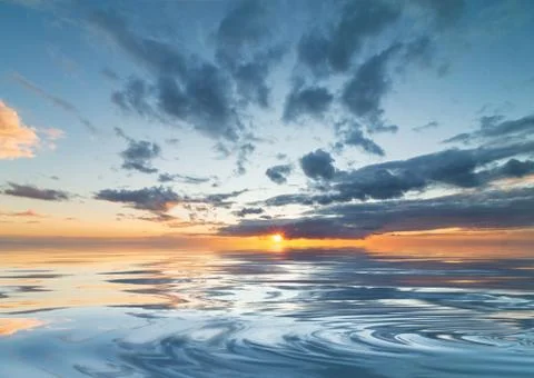 Dramatic sunset during the rain with blue sky Stock Photos