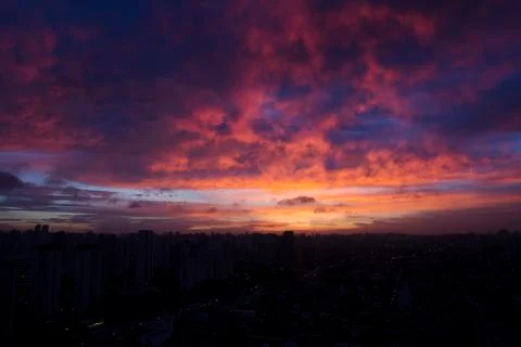 Dramatic sunset like fire in the sky with golden clouds. Stock Photos