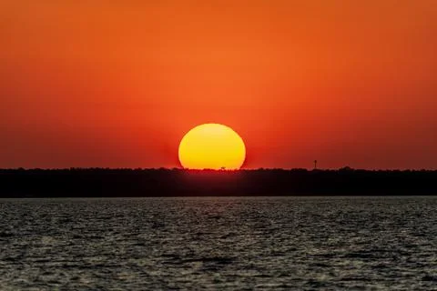 Dramatic sunset on the horizon at Cullen Bay Stock Photos