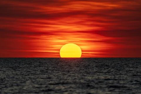 Dramatic sunset on the horizon at Mindil Beach Stock Photos