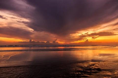 Dramatic Sunset in Kuta beach, Bali, Indonesia Stock Photos
