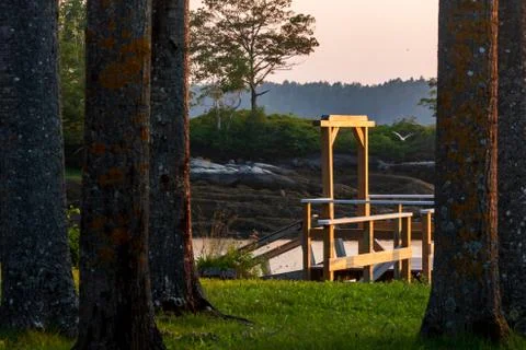 Dramatic sunset of a lake looking off a dock Stock Photos