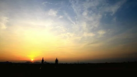 Dramatic Sunset Landscape with Silhouetted Trees and Colorful Sky Vídeos de archivo 310923092