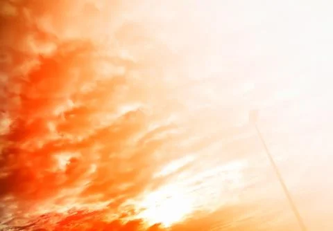 Dramatic sunset light leak with right aligned street lamp backgr Stock Photos