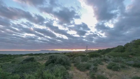Dramatic sunset at the lighthouse, Cabo selines, Mallorca, Balearic Islands S Stock Footage 133192808