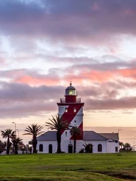 Dramatic sunset on the lighthouse of Cape Town - 4 Stock Photos
