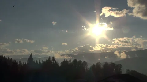 Dramatic sunset at the mountains, clouds and birds on a blue sky Stock Footage 31501798