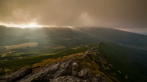 Dramatic sunset in the mountains. Sunrays and mist Stock Footage 97363357