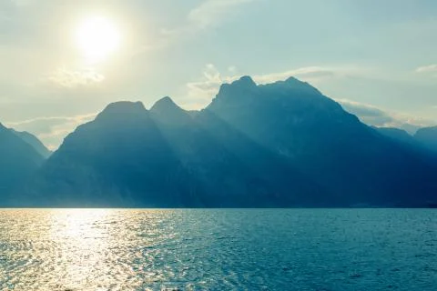 Dramatic sunset with mountains view on Lake Garda, Italy Stock Photos