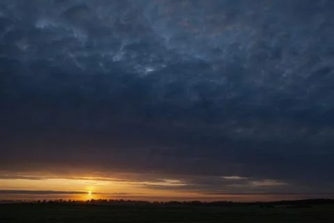 Dramatic Sunset with Ominous Clouds Stock Photos