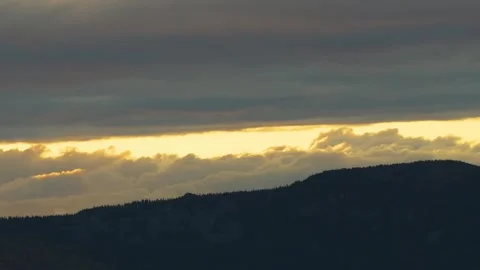 Dramatic Sunset or Sunrise Over Southern Urals Mountains, Russia with Golden Clo Video stock 325358922