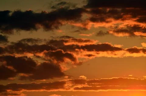 Dramatic sunset in orange tones Stock Photos