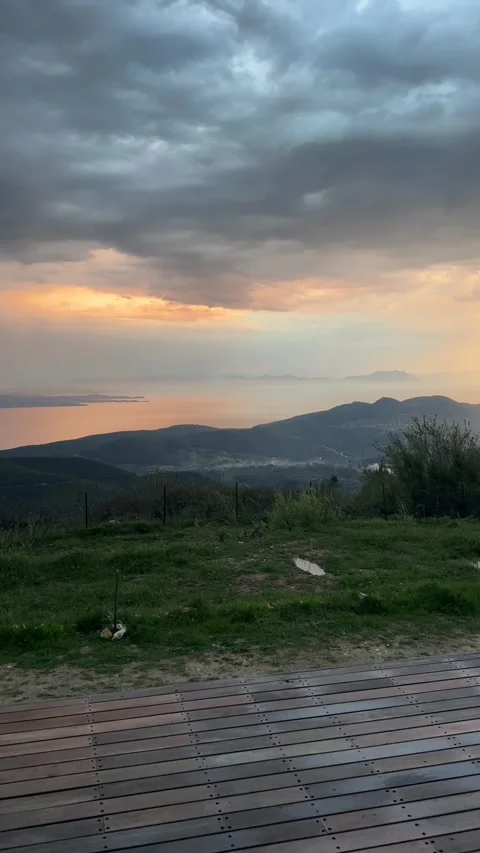 Dramatic Sunset Over Aegean Mountains from Wooden Terrace, Mugla Turkey Stock Footage 333522417