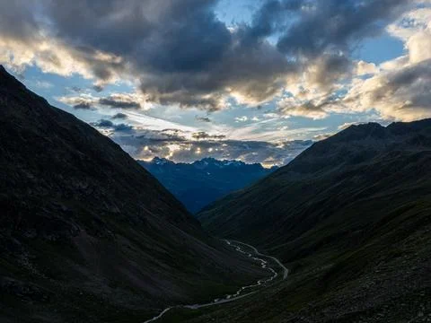 Dramatic Sunset Over Alpine Mountain Valley Stock Photos
