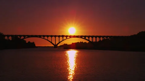 Dramatic Sunset Over Arched Bridge Stock Footage 35288211
