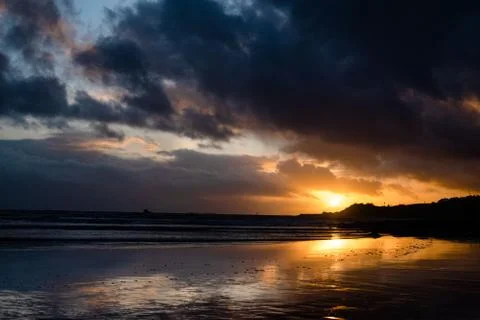 Dramatic sunset over a beach 스톡 사진