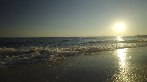 Dramatic sunset over beautiful beach Stockbeeldmateriaal 212947382