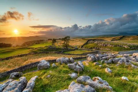 Dramatic sunset over beautiful scenery at the Winskill Stones Stock Photos