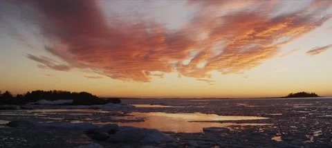 Dramatic sunset over a big lake during melt season Stock Footage 185442183