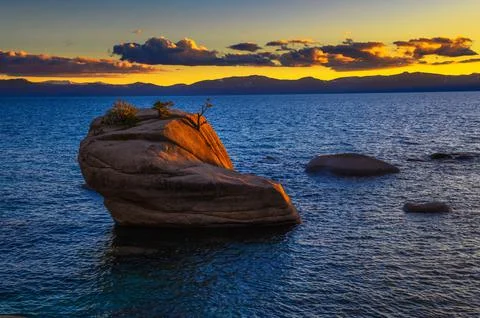 Dramatic sunset over the Bonsai Rock of Lake Tahoe, Nevada 写真素材