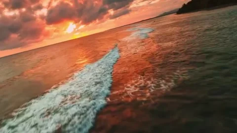 A dramatic sunset over a calm sea 스톡 동영상 328979722