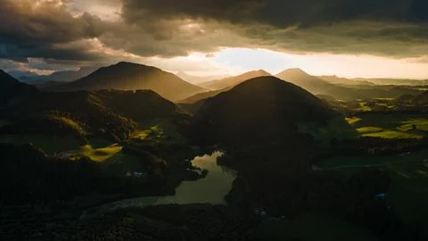 Dramatic Sunset Over a Charming Alpine Village and Church in the Austrian Alp Stock Photos