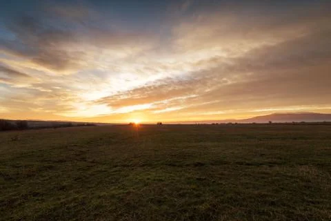 Dramatic sunset over a field 5 Stock Photos