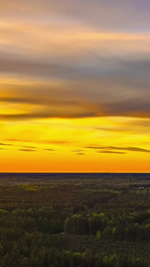 Dramatic Sunset Over Forest and Silhouetted Hills Stock Footage 315481517