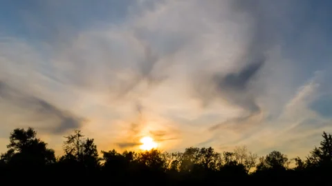 Dramatic sunset over the forest silhouette, outdoor sunset time lapse scene Stock Footage 160685791