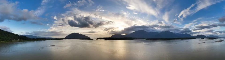 Dramatic Sunset over Fraser River. Nature Landscape Background Panorama Stock Photos
