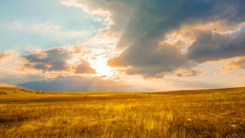 Dramatic sunset over the grass prairie Stock Footage 141208535