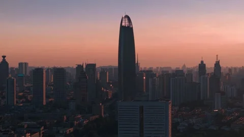 Dramatic Sunset over Jinan City with Greenland Puli Center Stock Footage 331215209